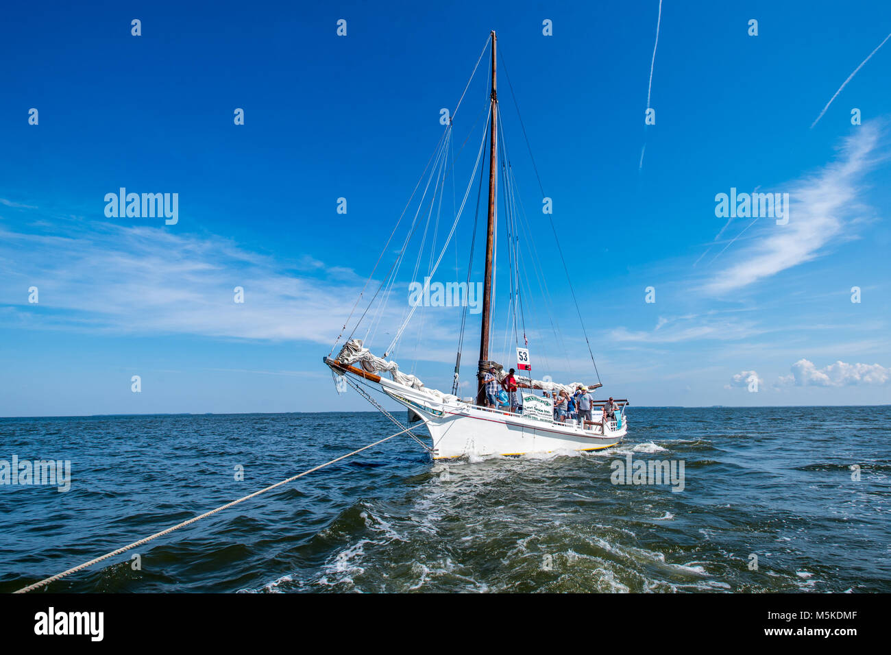 Rope attached to traditional Skipjack boat as it gets pulled along the