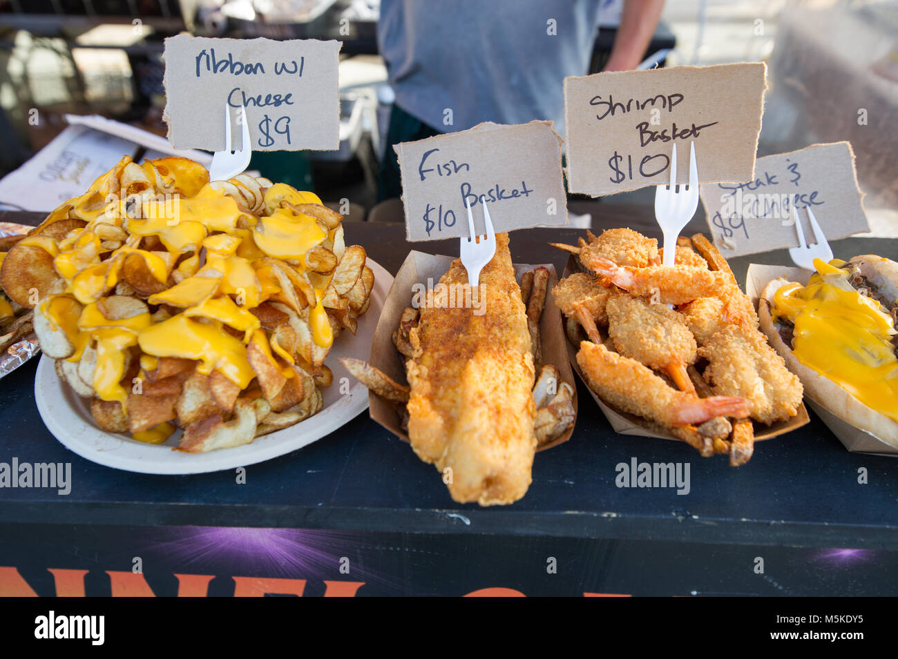 Assortment of deep fried food options sitting on counter at food truck