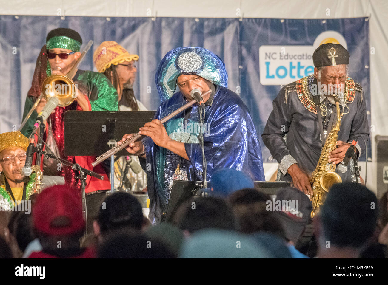 Members From The Cosmic Group Sun Ra Arkestra Playing Various Instruments Together On Stage At National Folk Life Festival Greensboro North Carolina Stock Photo Alamy