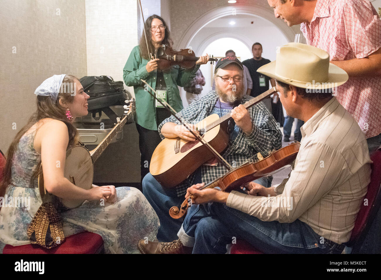 Group of musicians playing stringed instruments together,  Greensboro, North Carolina. Stock Photo