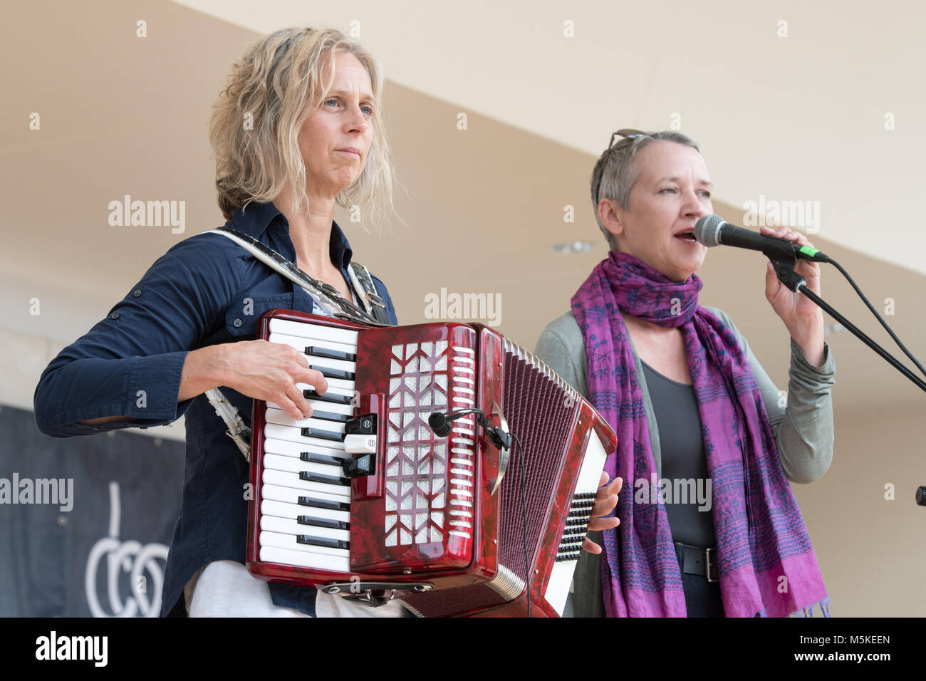 Mary Jane Lemond and Wendy MacIssac singing and playing the accordion on stage for the National Folk Life Festival, Greensboro, North Carolina. Stock Photo