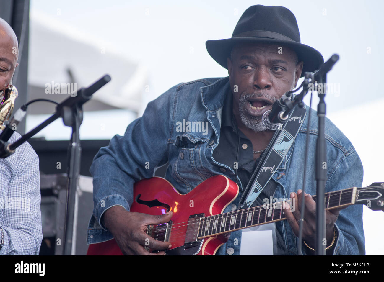 Lurrie Bell belts out a soulful song while playing electric guitar at National Folk Life Festival, Greensboro, North Carolina. Stock Photo