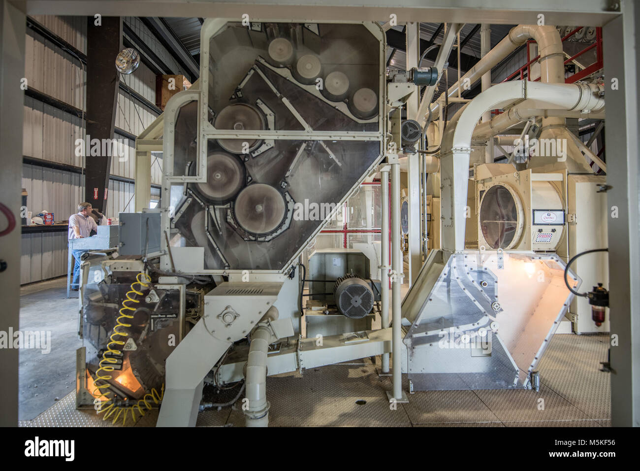 Exposed side of Micro Cotton Gin revealing mechanical workings used to