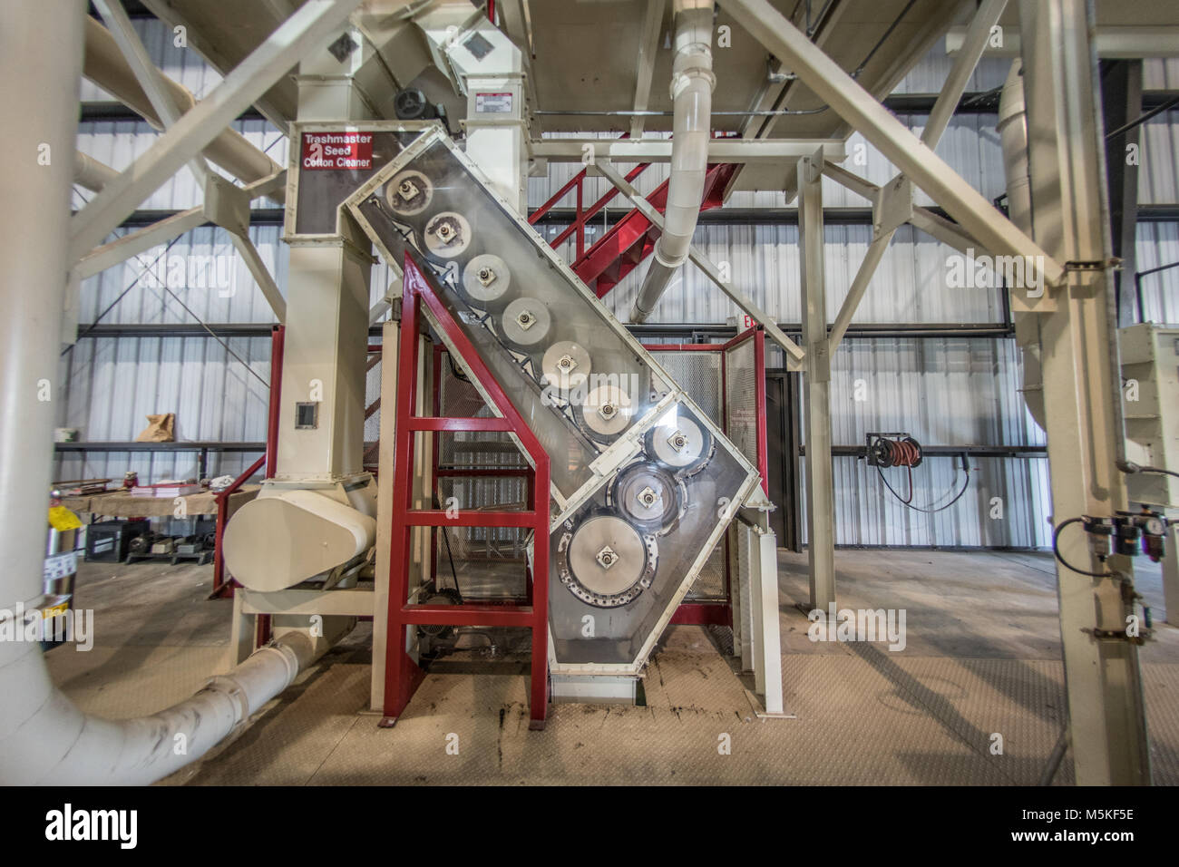 Exposed side of Micro Cotton Gin revealing mechanical workings used to
