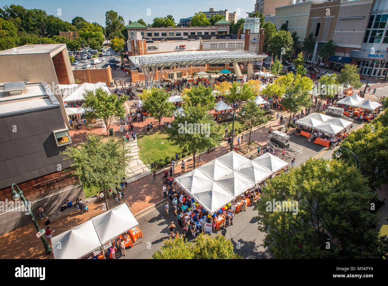 Overlooking crowded street festival with pop up tents at civic building in Silver Spring, Maryland Stock Photo
