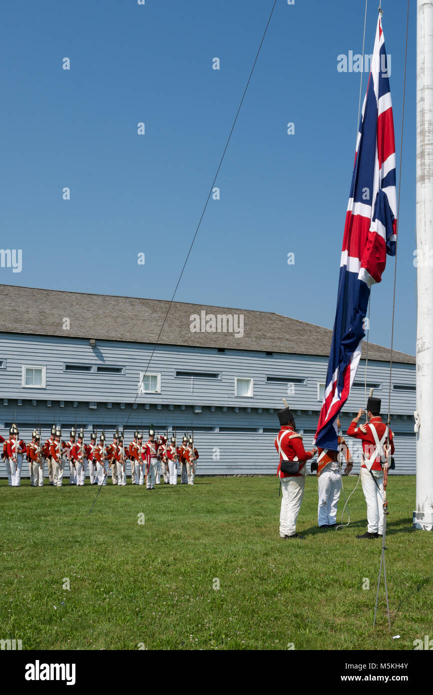 Raising the Flag at the Morning Parade at the Fort George Historic Site, Niagara-on-the-Lake, Ontario, Canada Stock Photo