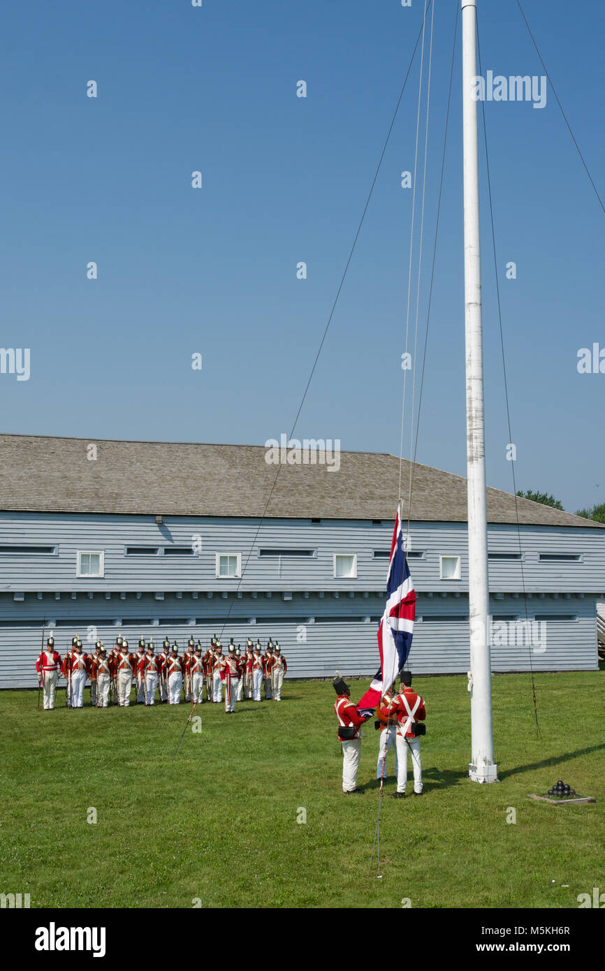 Raising the Flag at the Morning Parade at the Fort George Historic Site, Niagara-on-the-Lake, Ontario, Canada Stock Photo