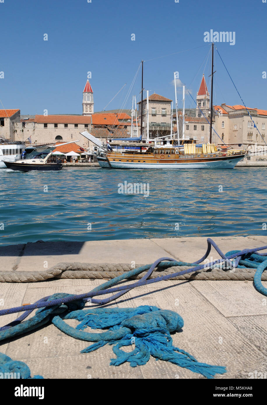 Trogir, Croatia. Sunny promenade along the pier of old Venetian town, Dalmatian Coast in Croatia. Stock Photo