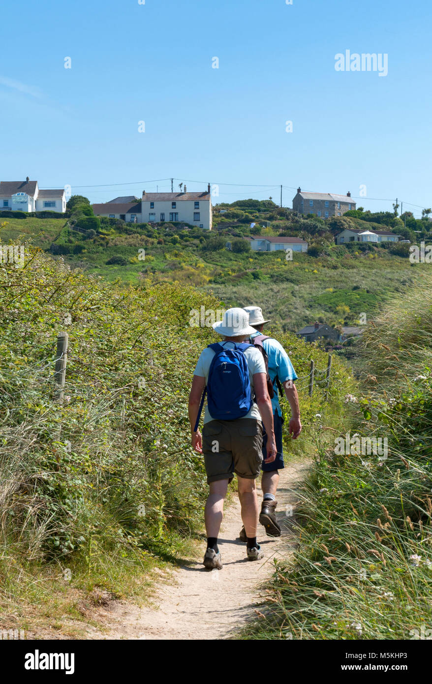 people walking on the south west coast path near sennen cove, cornwall, england, britain, uk. Stock Photo