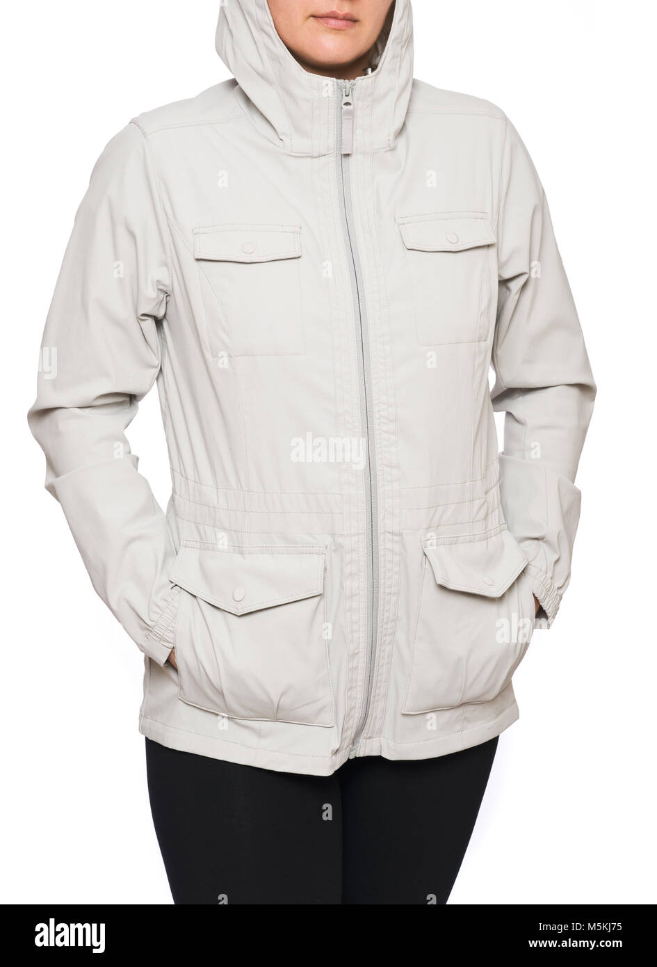 Young woman wearing beige rain jacket isolated on white background