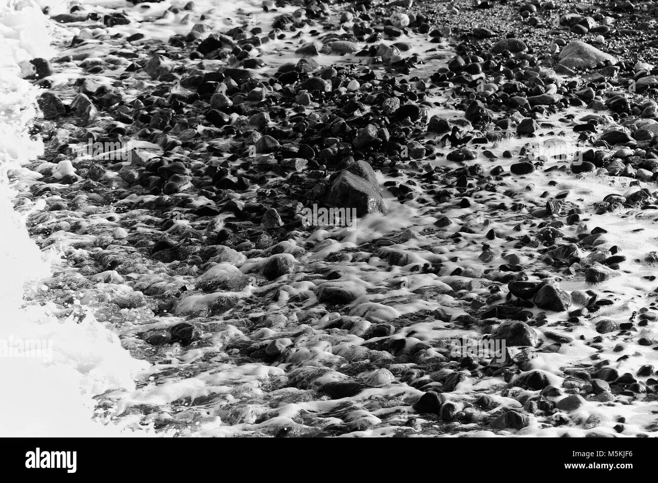 Beautiful blue sea pebbles beach Black and White Stock Photos & Images ...