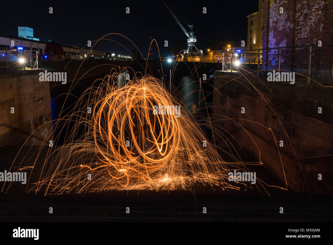Fireball in the harbour. Steel wool Stock Photo Alamy