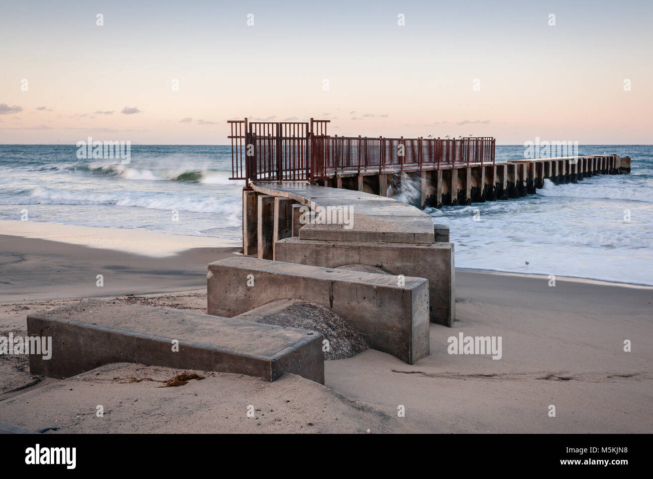 McGurk Beach Jetty Photographed at sunrise at Toes Beach in Playa Del Rey, CA. Stock Photo