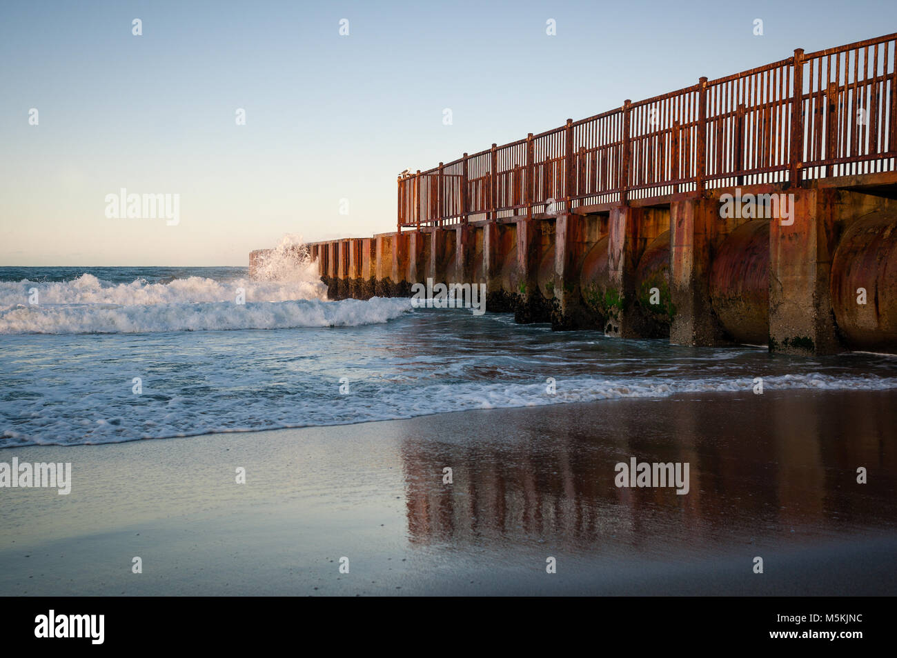 McGurk Beach Jetty photographed at sunrise at Toes Beach in Playa Del Rey, CA. Stock Photo