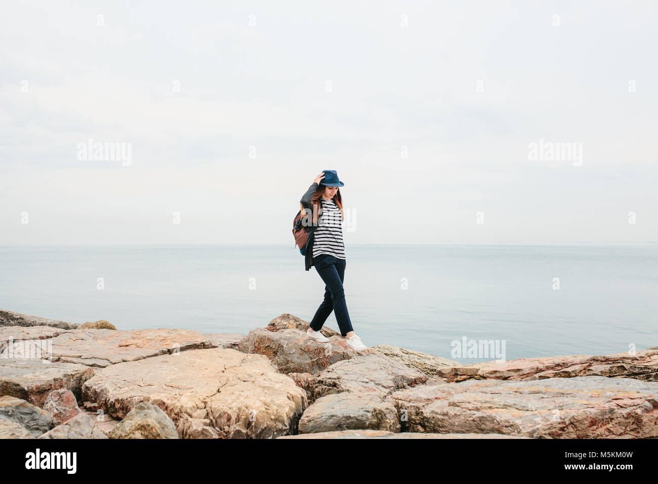 Hiking woman backpack hat walks hi-res stock photography and images - Alamy