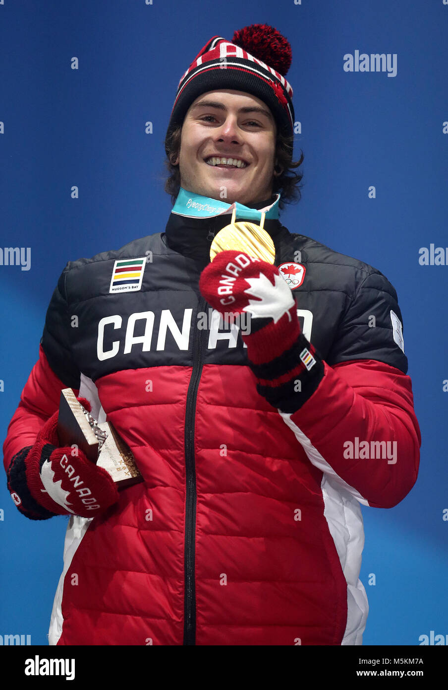 Canada's Sebastien Toutant celebrates with his Gold medal during the Men's  Snowboarding Big Air Final medal ceremony on day fifteen of the PyeongChang  2018 Winter Olympic Games in South Korea Stock Photo -