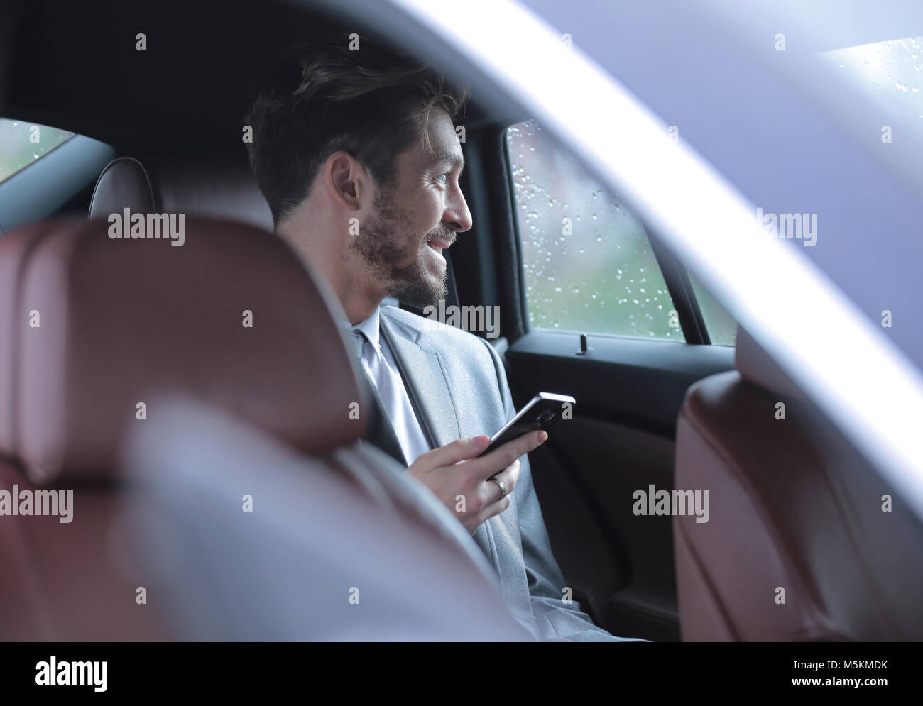 Handsome business man in car Stock Photo - Alamy