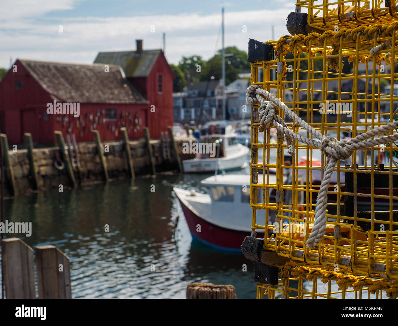 A view of Motif 1 and Rockport MA harbor with lobster traps in the