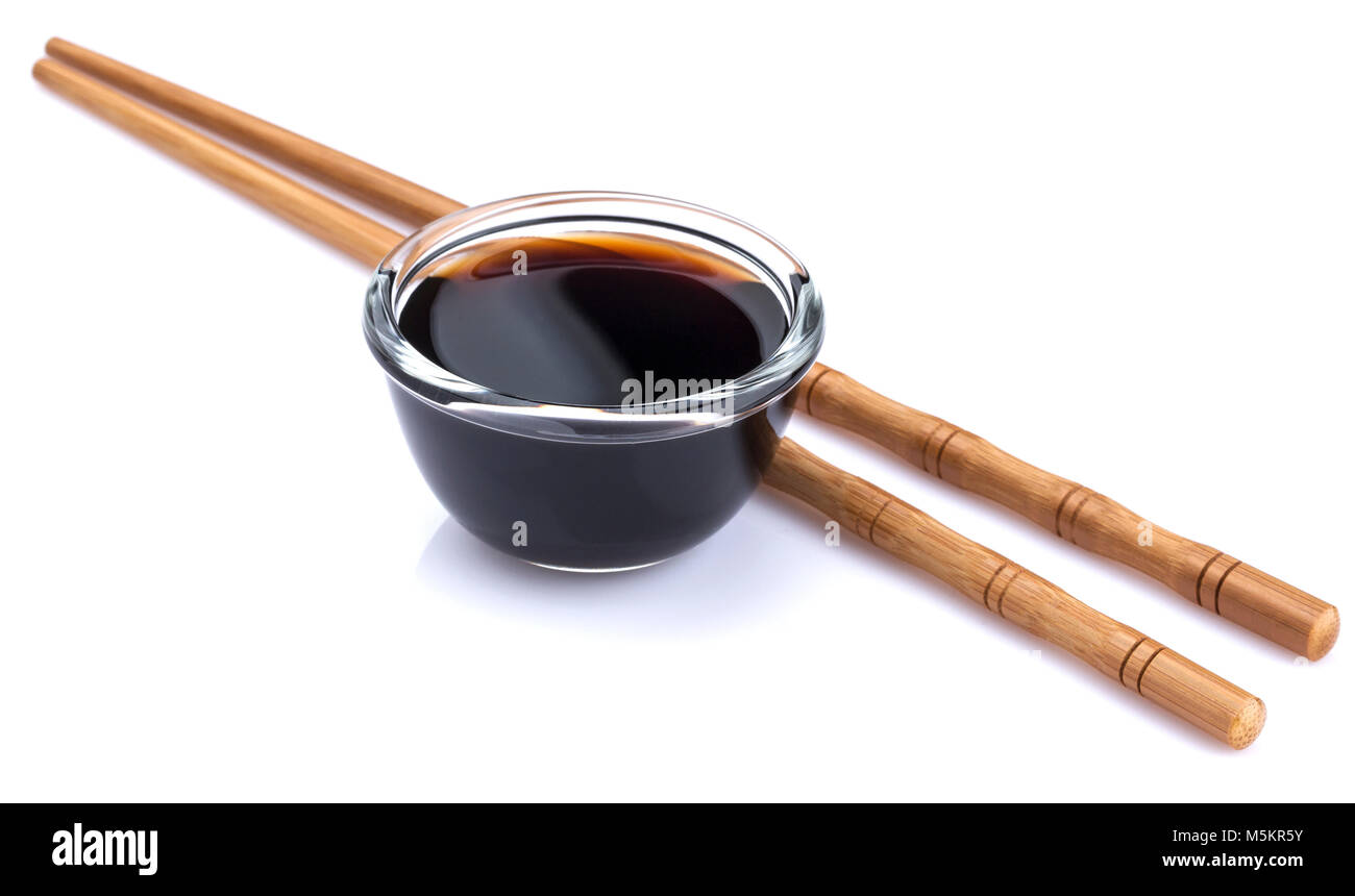 Soy sauce and bamboo chopsticks isolated on white background Stock Photo