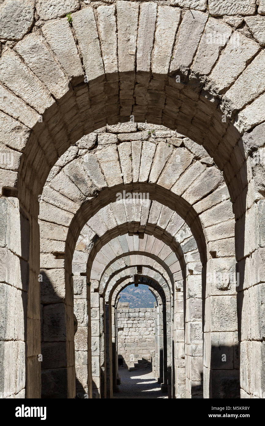 Roman vaulted substructures and archways in the ruins of the ancient city of Pergamum known also as Pergamon, Turkey Stock Photo