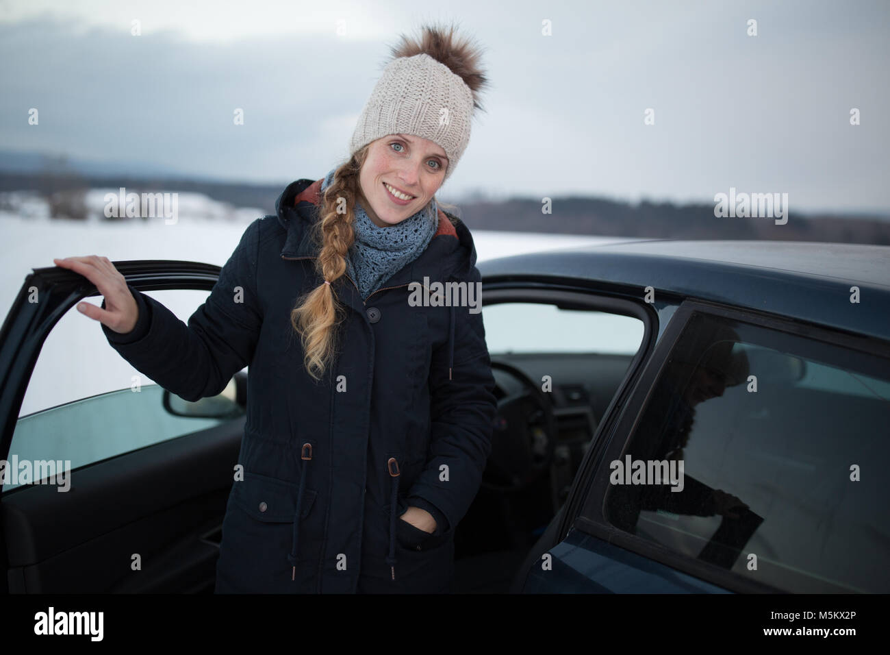Woman driving a car - female driver at a wheel of a modern car, looking ...