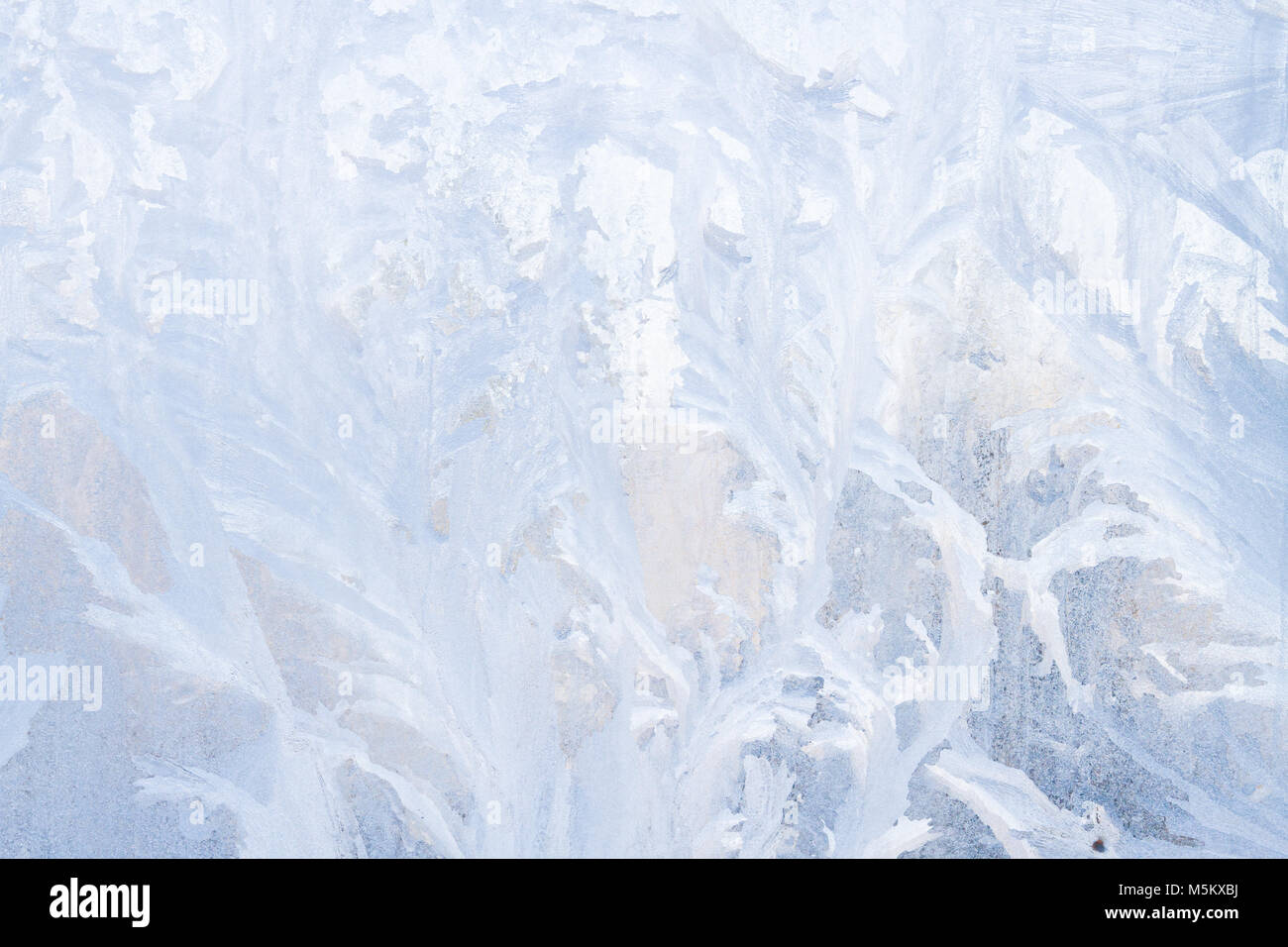 Winter frosty patterns on the frozen ice window Stock Photo - Alamy
