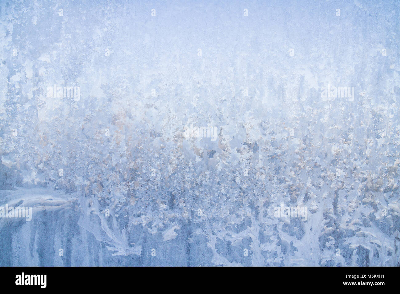 Winter frosty patterns on the frozen ice window Stock Photo - Alamy