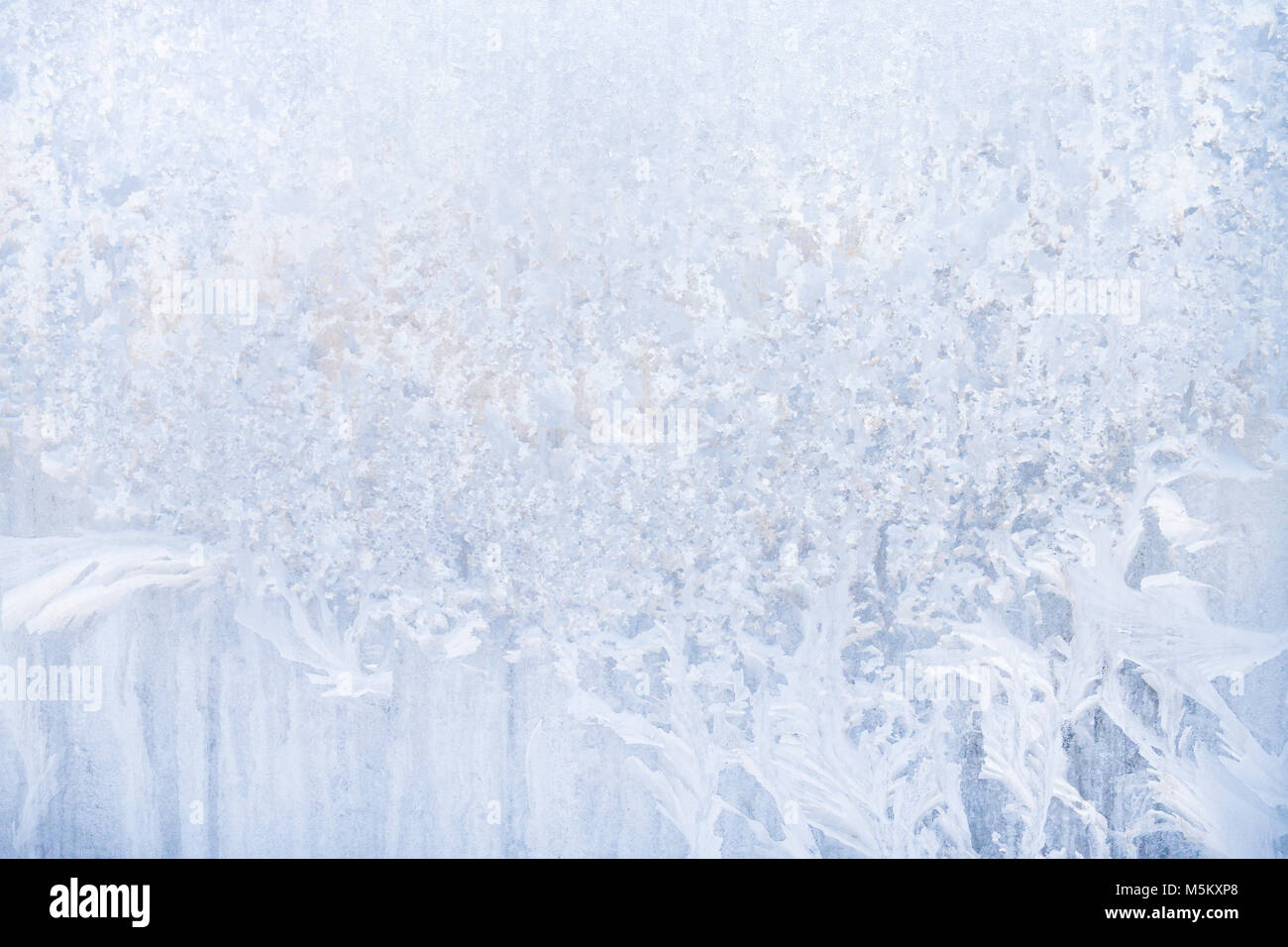 Winter frosty patterns on the frozen ice window Stock Photo - Alamy