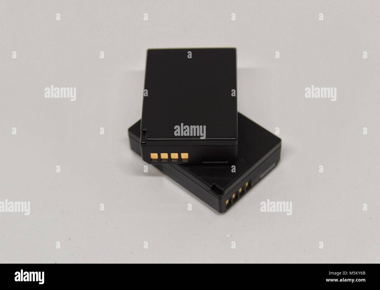 Digital camera batteries on white background Stock Photo Alamy