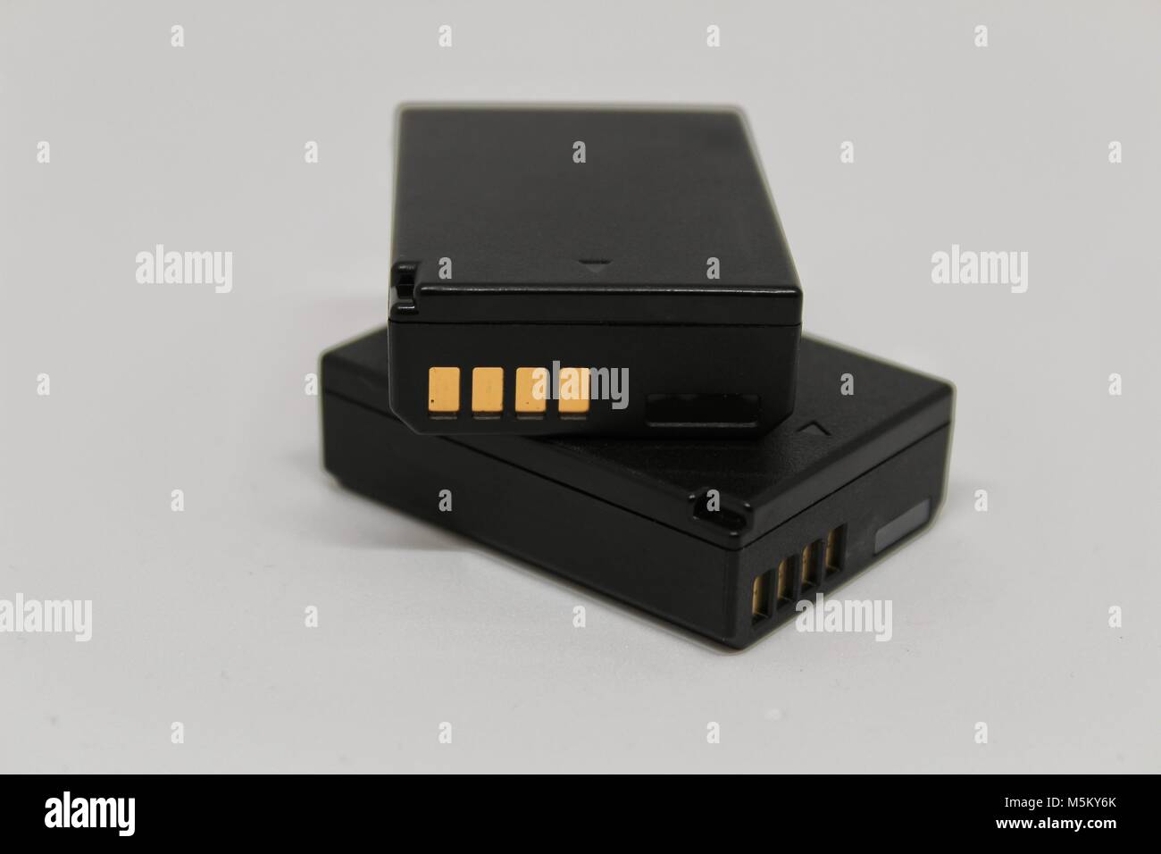 Digital camera batteries on white background Stock Photo Alamy
