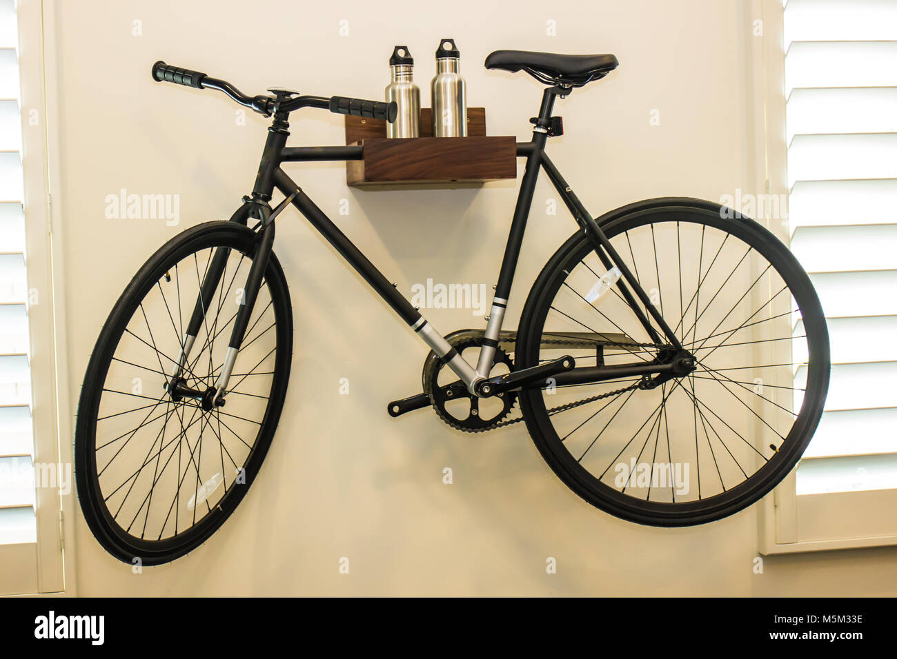 Bicycle Hanging On Bedroom Wall As Decoration Stock Photo Alamy