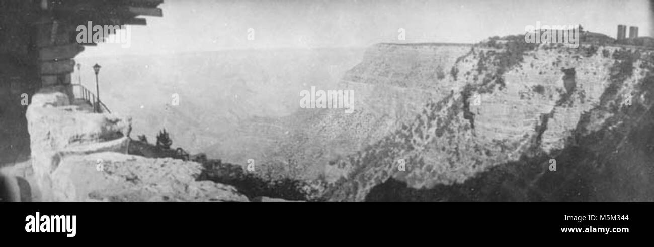 Grand Canyon Historic El Tovar Hotel View from Lookout . PANORAMIC VIEW OF RIM: ENTRANCE TO LOOKOUT STUDIO (L) EL TOVAR & WATER TANKS (R)CIRCA 1915. FRED HARVEY. Stock Photo