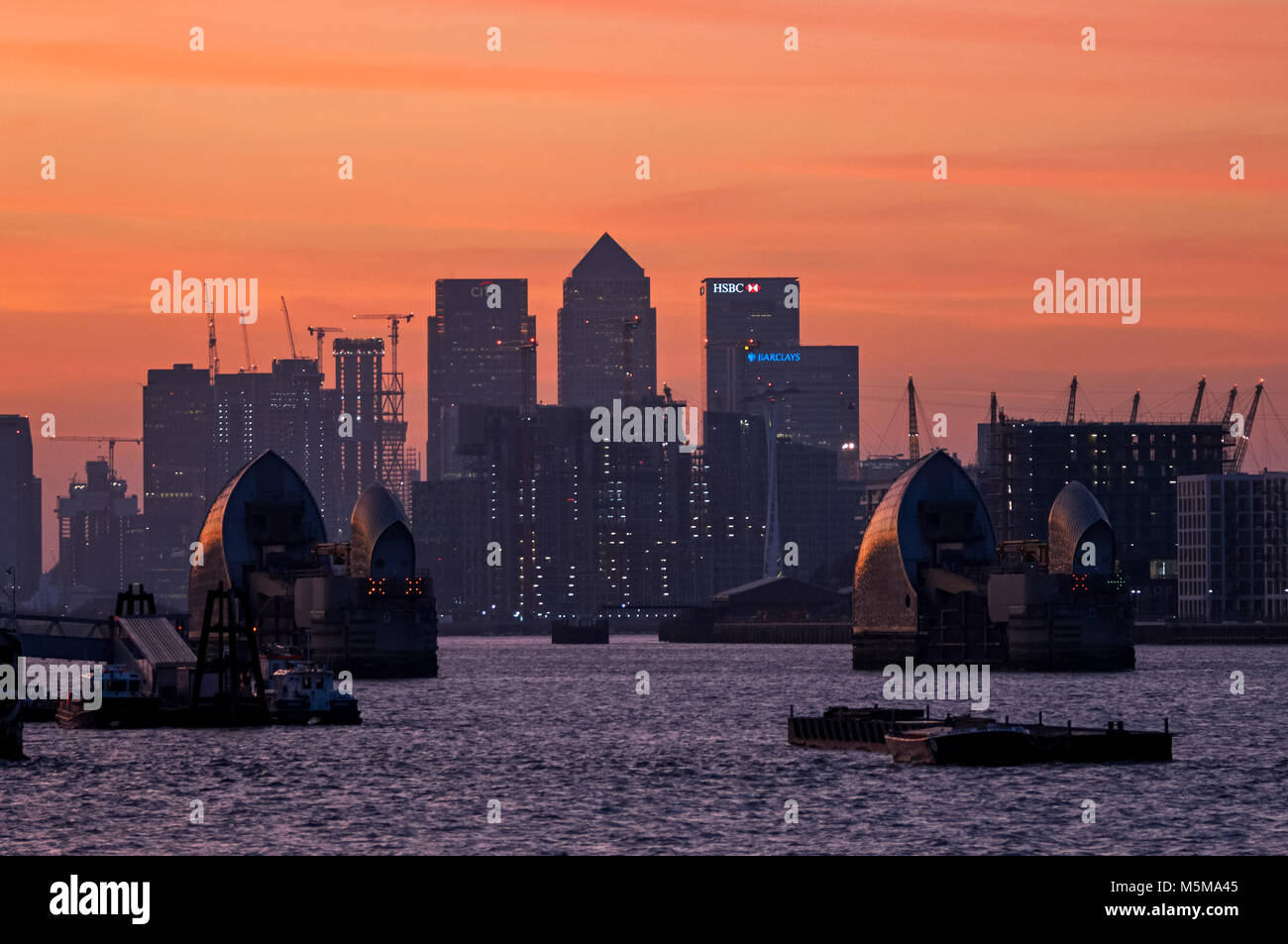 Canary Wharf and Thames Barrier at sunset, London, England, United ...
