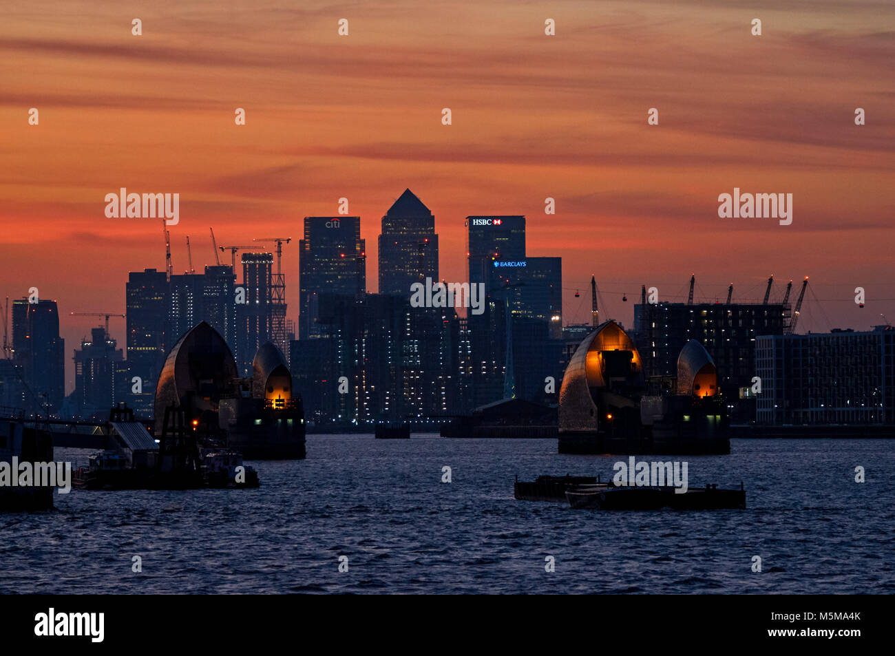 Canary Wharf and Thames Barrier at sunset, London, England, United ...