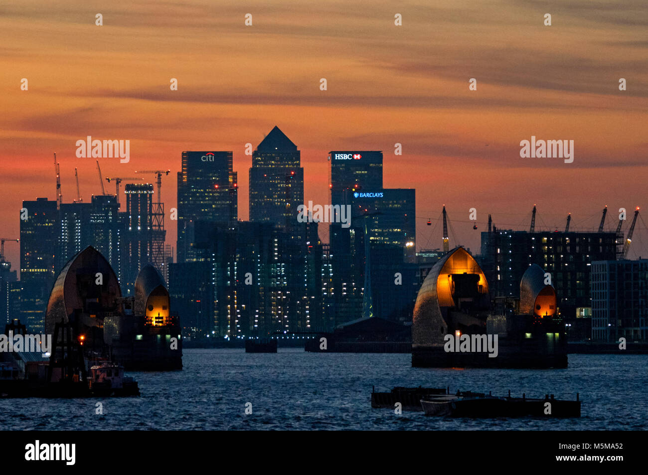 Canary Wharf and Thames Barrier at sunset, London, England, United ...