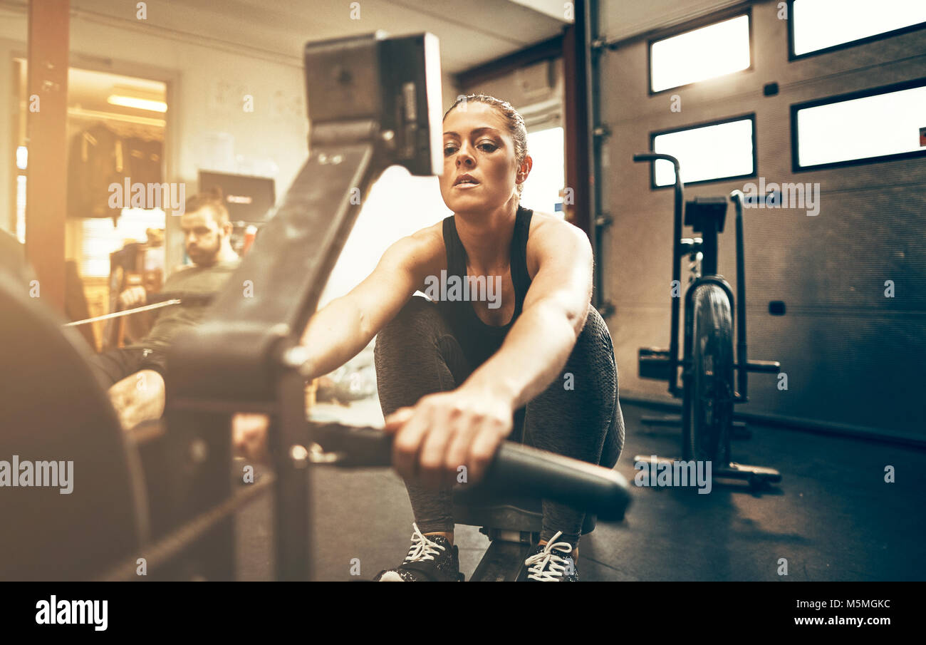 Woman working out on rowing hi-res stock photography and images - Alamy