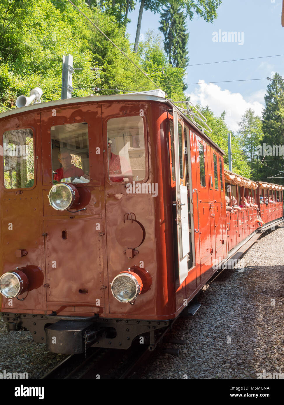 Tourists aboard Schynige Platte Railway Stock Photo