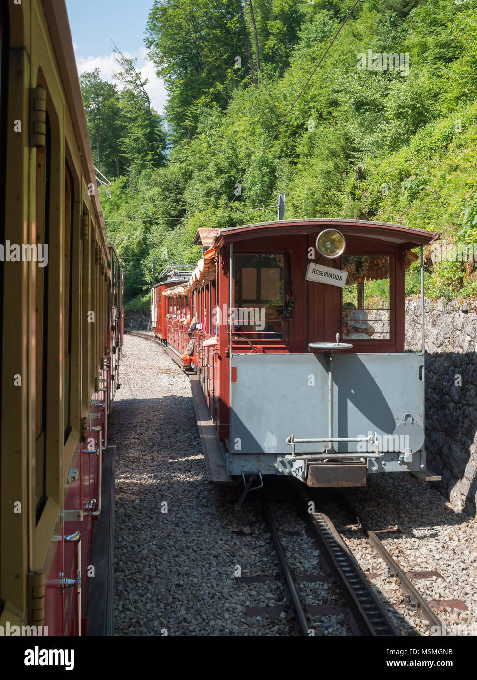 Tourists aboard Schynige Platte Railway Stock Photo