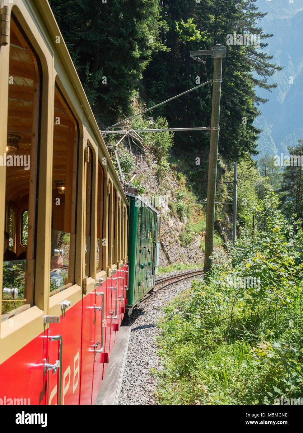 Schynige Platte Railway going up the mountain Stock Photo