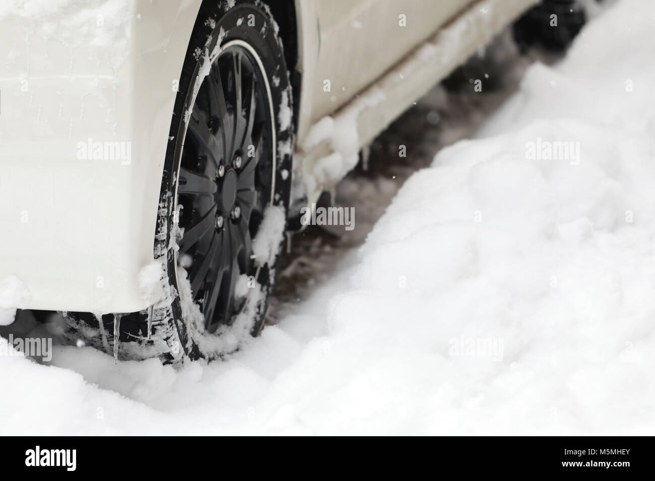 snow ice on tire,car tires on a snow,Frozen ice build up wheel fender