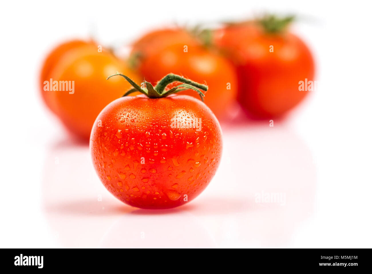 Tomato with water drops isolated on white background Stock Photo - Alamy