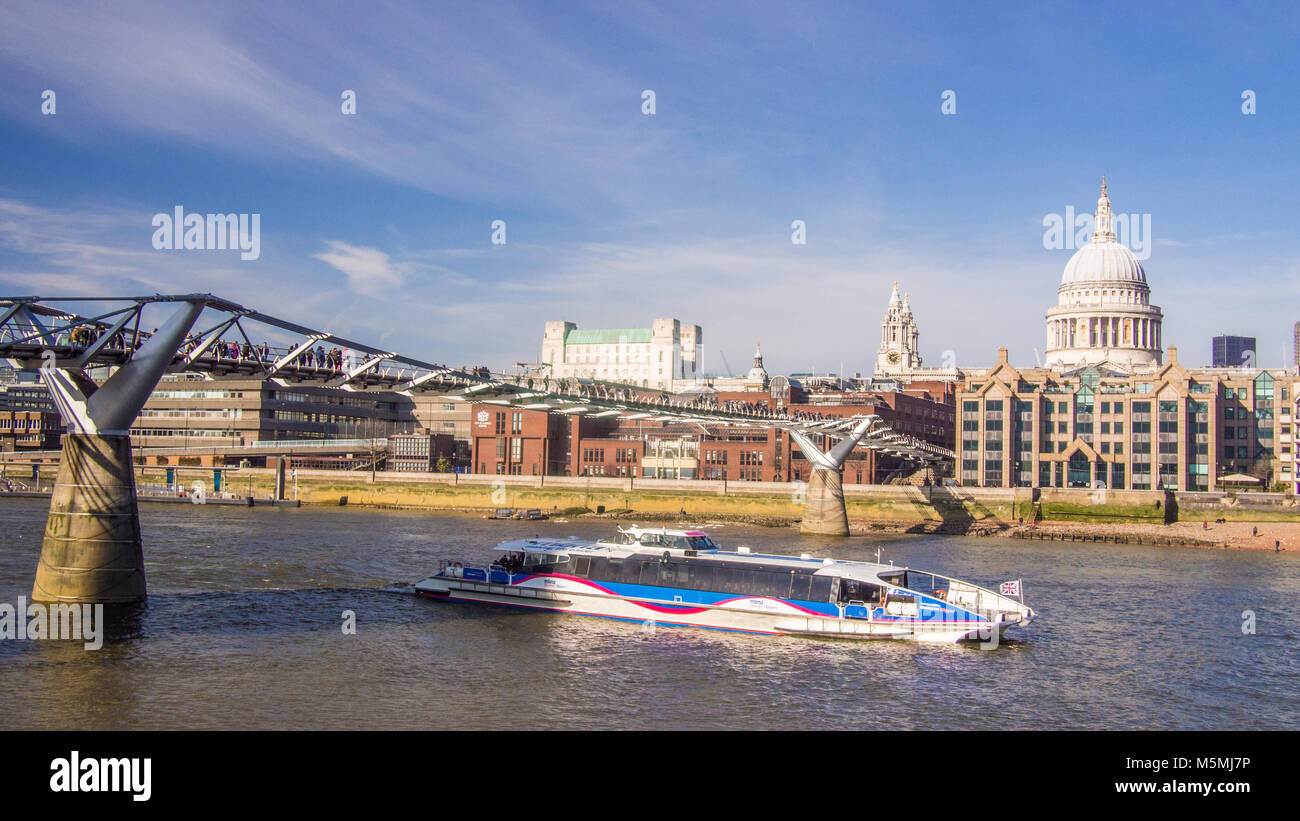 Millennium Bridge over the River Thames with St Pauls Cathedral on the right. Stock Photo