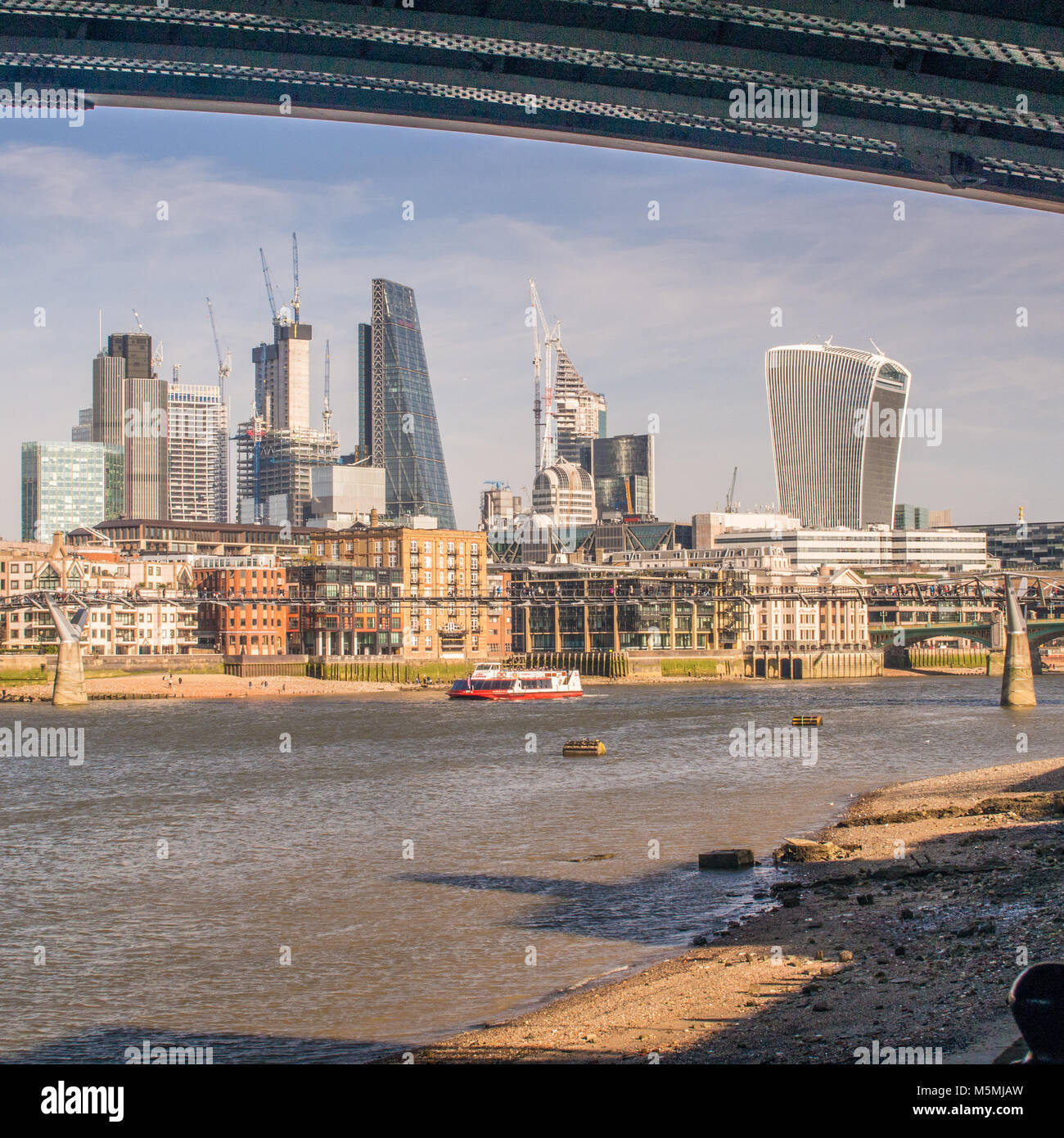 Looking towards the 'Cheese Grater' (mid left) and Walkie Talkie (Right) housing the Sky Garden. Millenium Bridge Stock Photo