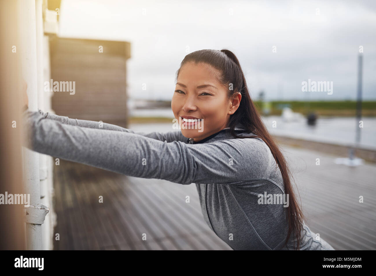 Young woman stretching jog hi-res stock photography and images - Alamy