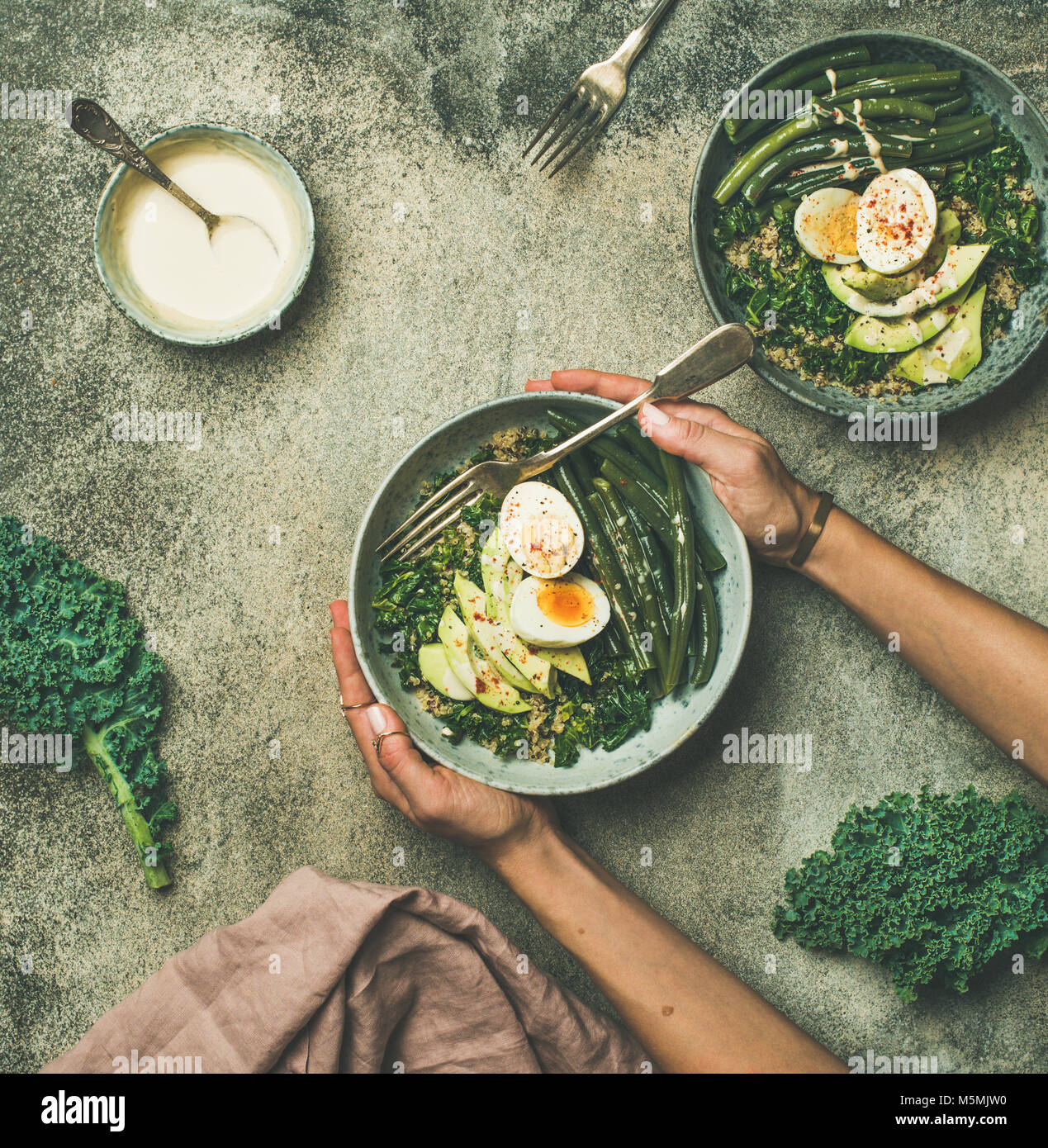 Quinoa, kale, beans, avocado, egg bowls, top view Stock Photo Alamy