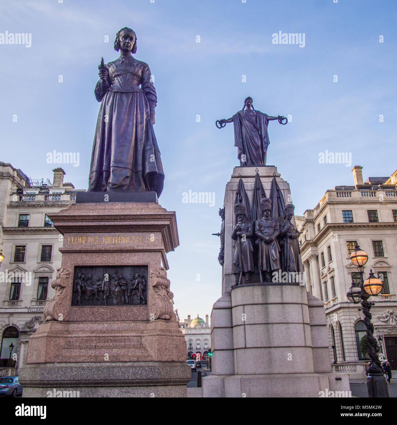 Left : Florence Nightingale with lamp statue. Right :Guards Crimean War Memorial, Waterloo Place, London. Stock Photo