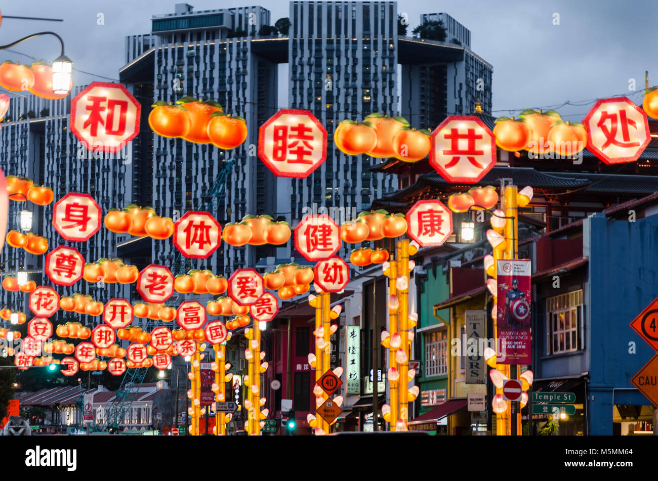 Chinatown Singapore celebrate Chinese New Year with light decoration along the road with word of blessing. Word reads Live in Harmony. Stock Photo