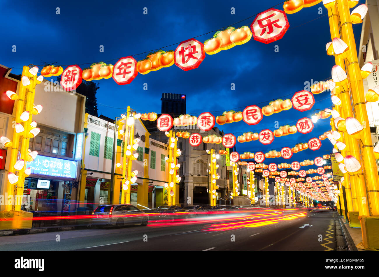 Chinatown Singapore celebrate Chinese New Year with light decoration along the road with word of blessing. Word reads Happy Chinese New Year. Stock Photo