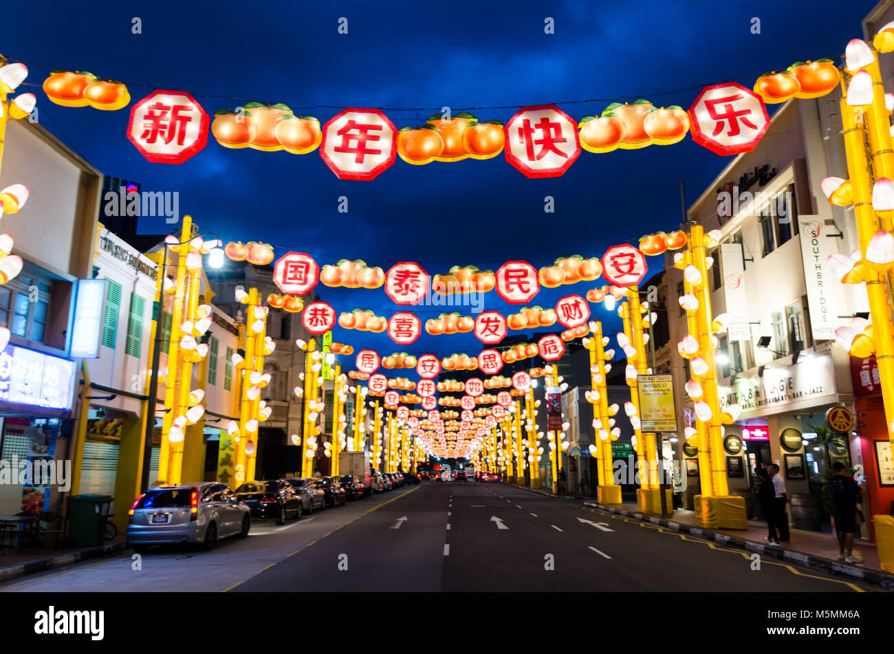 Chinatown Singapore celebrate Chinese New Year with light decoration along the road with word of blessing. Word reads Happy Chinese New Year. Stock Photo