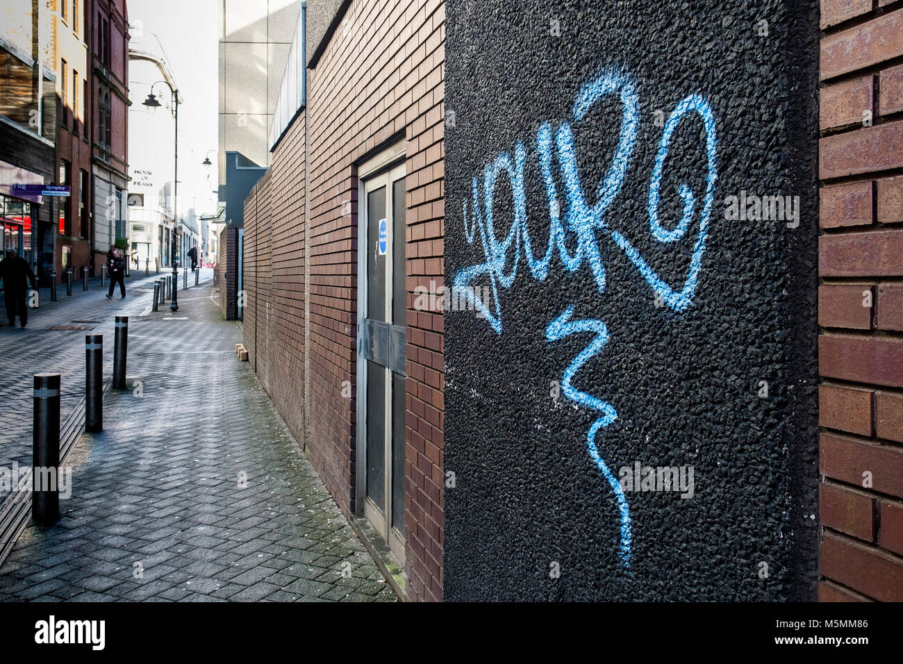 Graffiti tag sprayed on a wall in Cardiff City centre Wales. Stock Photo
